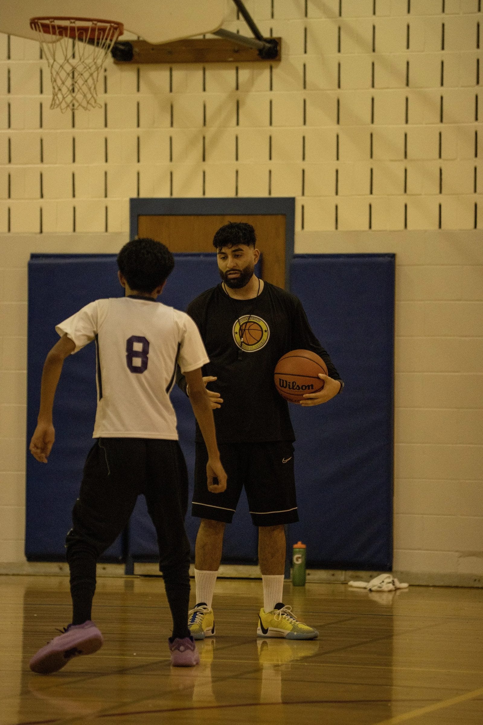 Coach Anthony coaching an athlete through a live rep
