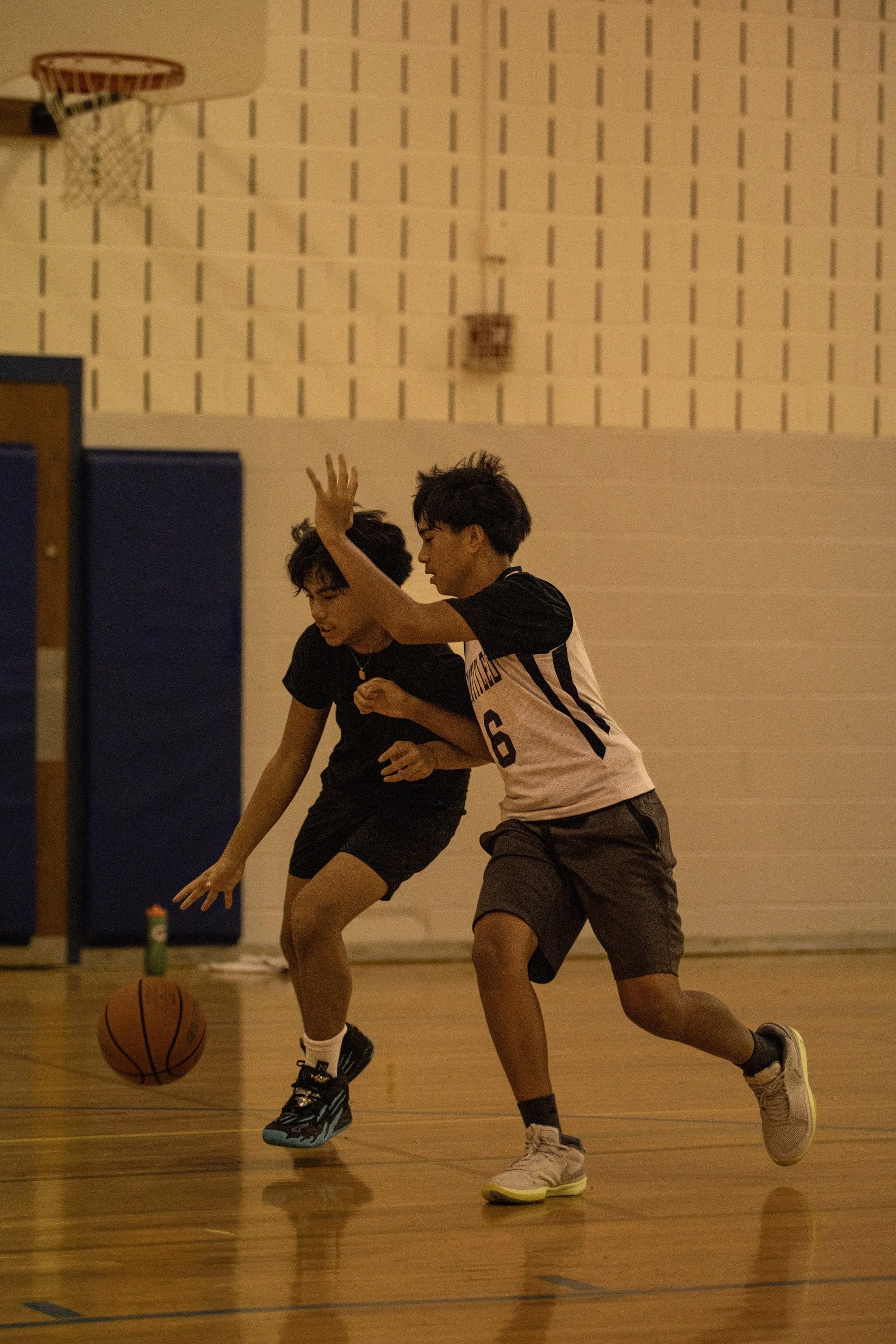 An ABBA athlete driving past a defender during a live possession