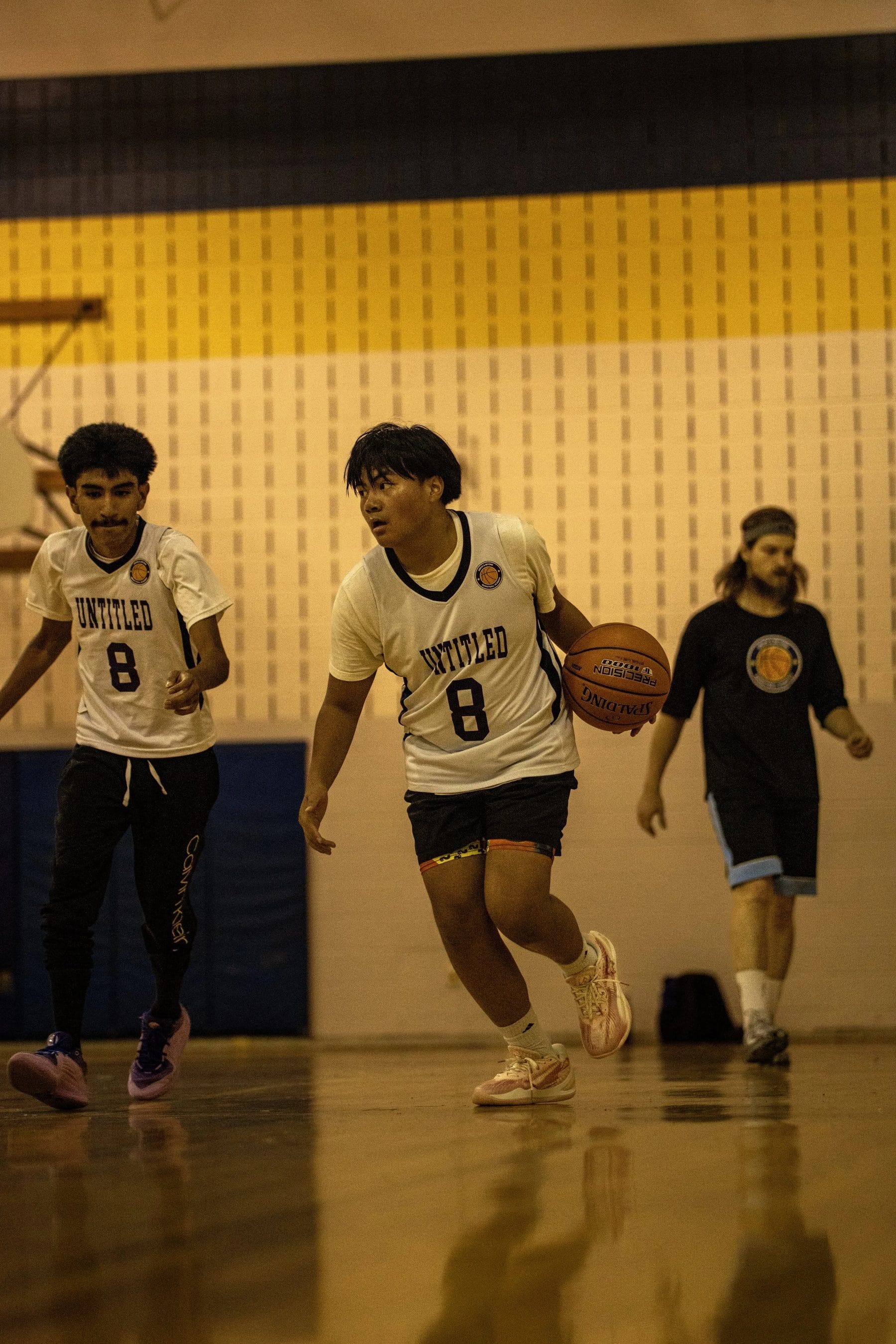 Two players competing for the ball during a live 3v3 possession